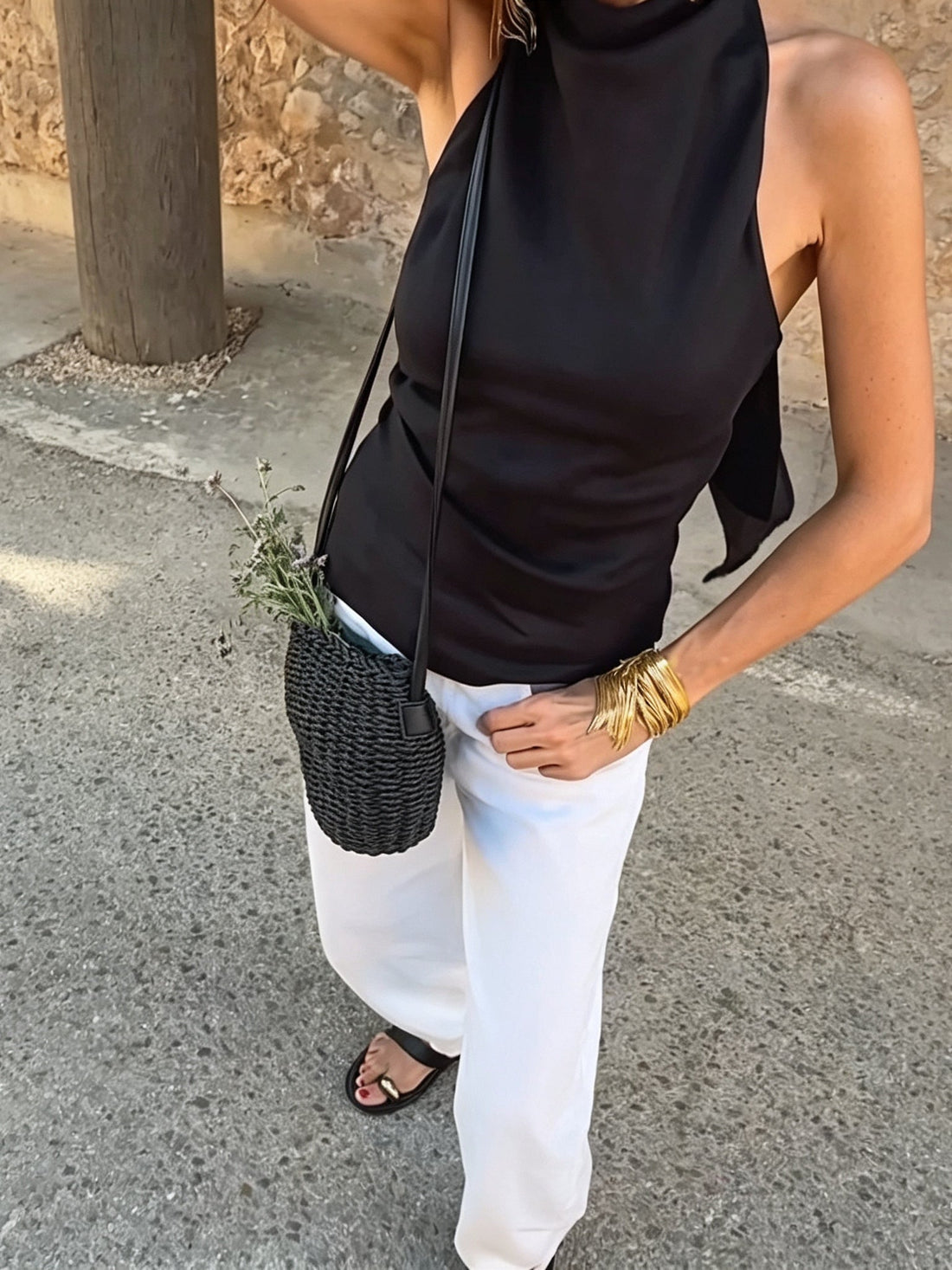 Casual black halter-neck tank top and white trousers set